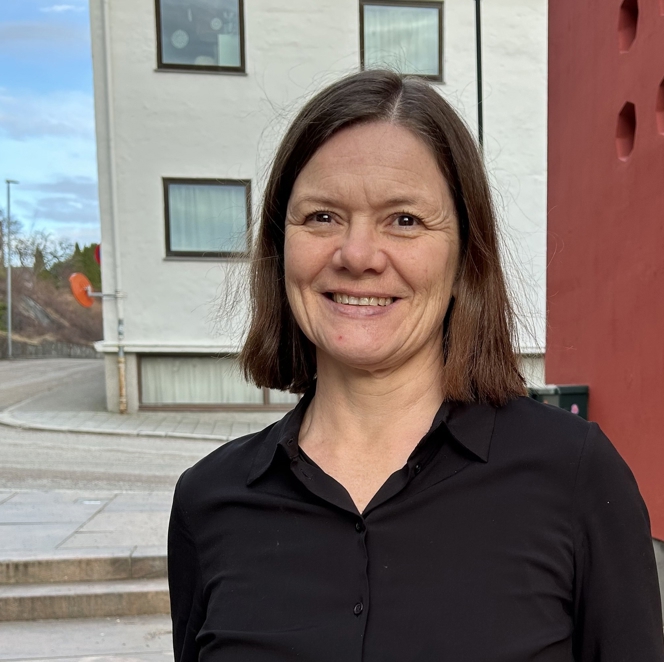 En person som smiler for kameraet