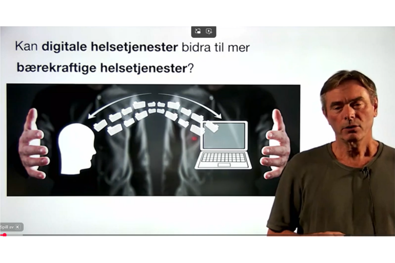Skjermdump viser en mann foran grafikk