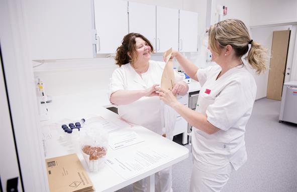 A couple of women in white coats